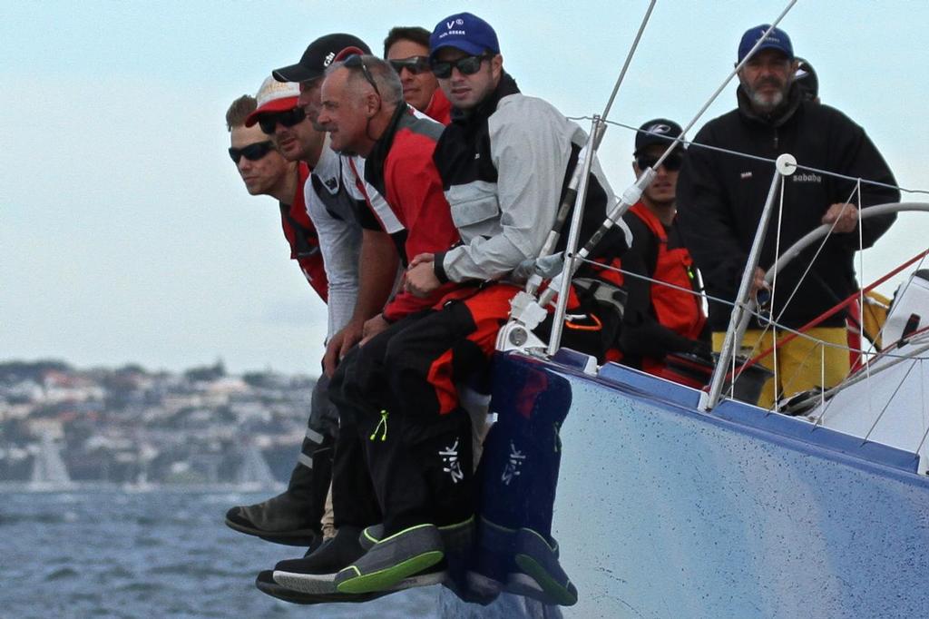 Two of the Zhik testing team at work - Ben Gladwell on the bow of V5, and Blair Tuke down aft, alongside the helmsman- 2014 ANZ Fiji Race © Richard Gladwell www.photosport.co.nz